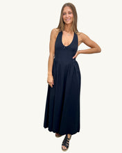 Load image into Gallery viewer, Woman wearing a black halter neck dress