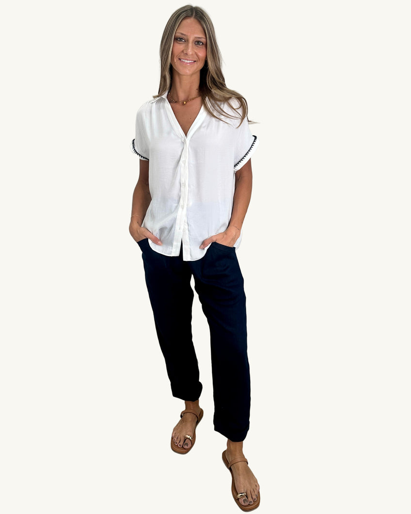 white blouse black stitching